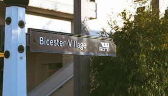 signage for 'Bicester Village'. We offer VIP Pass