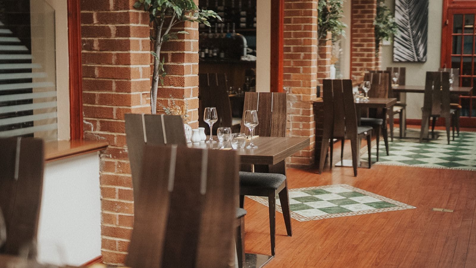 Interior view of Cleaver Cabarfeidh Hotel with neatly arranged tables and chairs for dining.