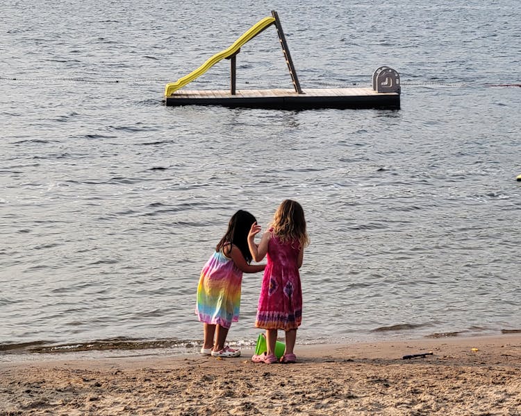Kid-Friendly Beach Play at Dayspring Cottages - Little Girls Enjoying Sand and Sun