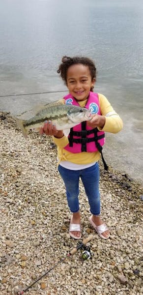 little girl fishing holding small mouth bass table rock lake fishing