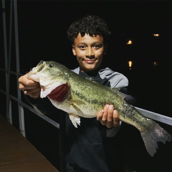 table rock lake fishing boy holding monster large mouth bass