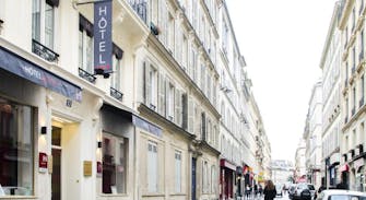 Façade de l’hôtel Migny dans une rue parisienne.