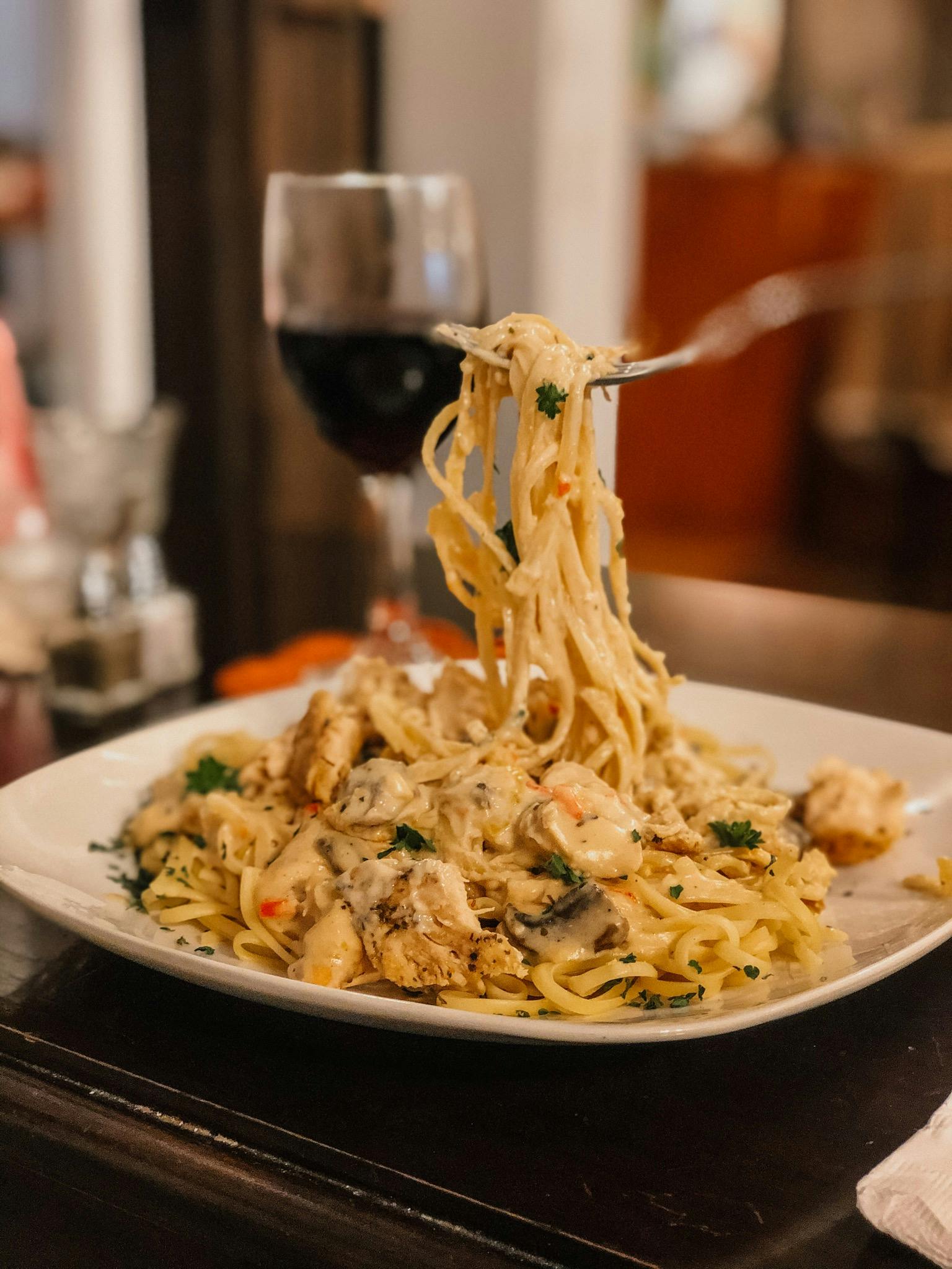 grilled chicken linguine in roasted garlic alfredo sauce at wild daisy cafe.