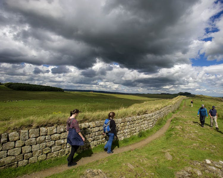 Groups of walkers along Hadrian's Wall near Haltwhistle, Northumberland