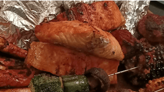 Serve of roast vegetables on three kebab skewers.