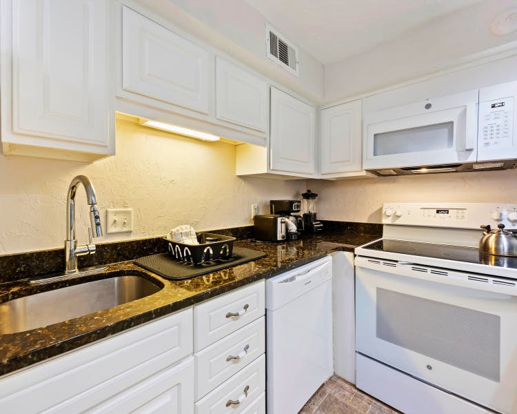 Full kitchen with modern appliances in two-bedroom Sea Crest Surf & Racquet Club condo rental