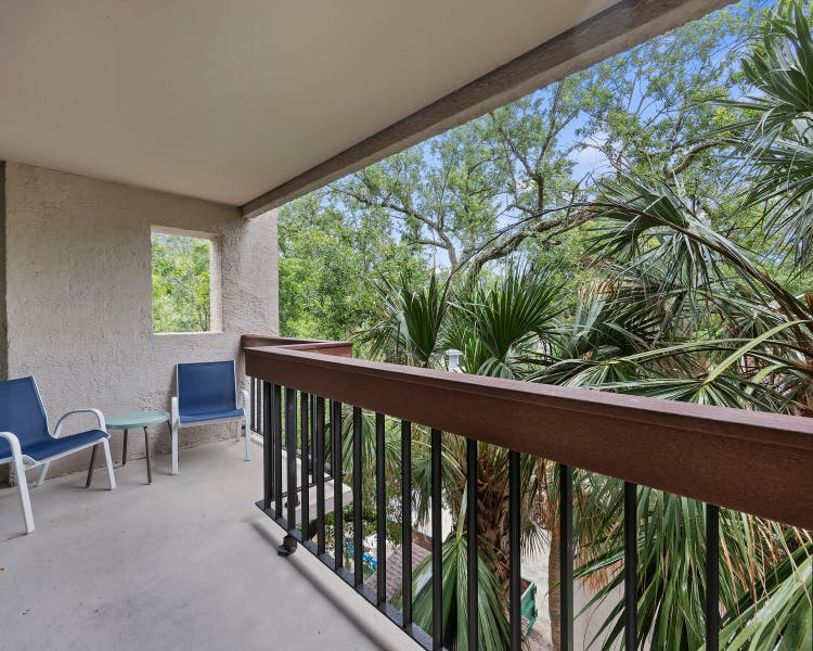 Private balcony with tropical views at Sea Crest Surf & Racquet Club Hilton Head Island