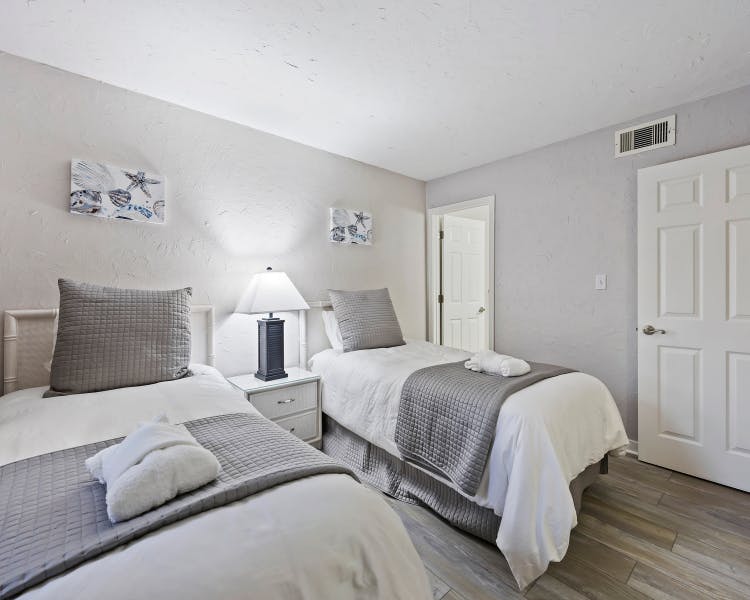 Spacious twin bedroom perfect for kids or guests at Sea Crest two-bedroom rental