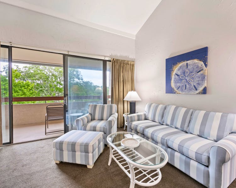 Living room at Sea Crest Surf & Racquet Club 1 Bedroom + Loft unit with balcony view