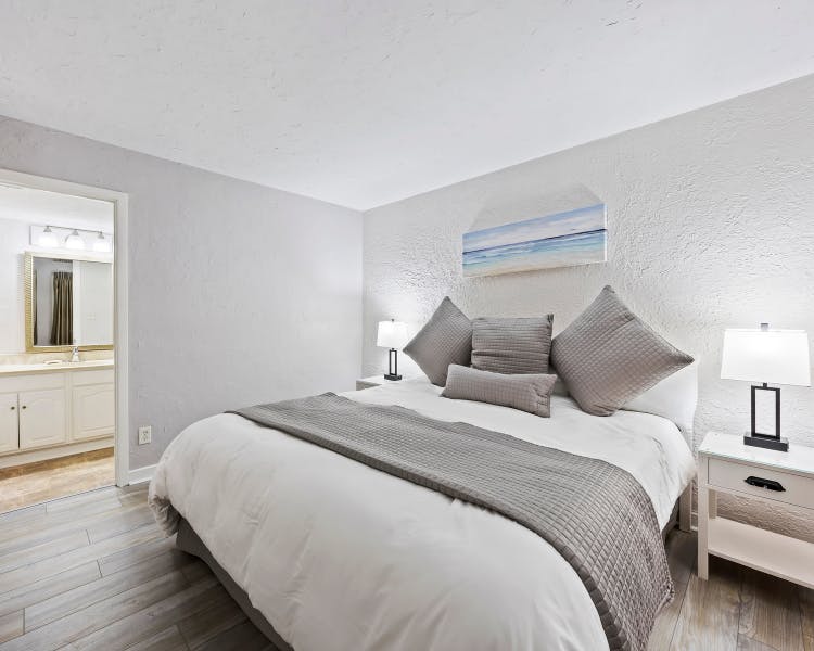 Comfortable master suite with king bed and private bath in Sea Crest two-bedroom condo