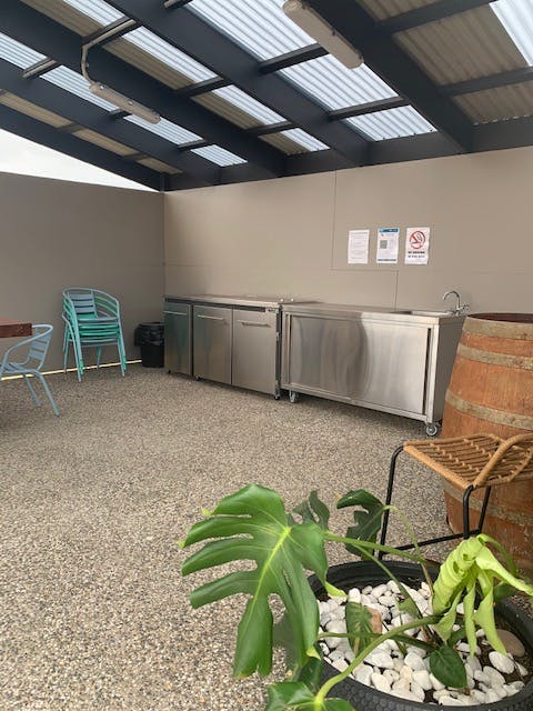 Communal barbeque area with wash area.