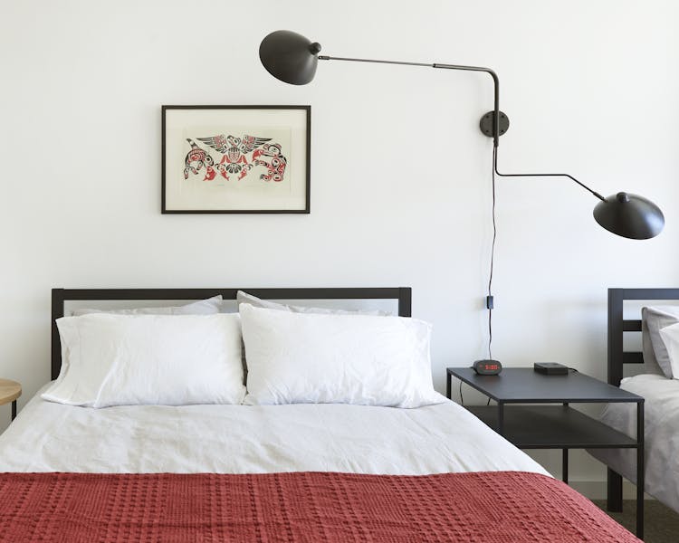 Two queen beds, attached bathroom, full kitchen.