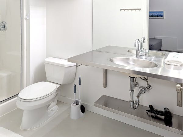 One queen bed and private bathroom in the Magpie Room at Snob Hollow Inn.