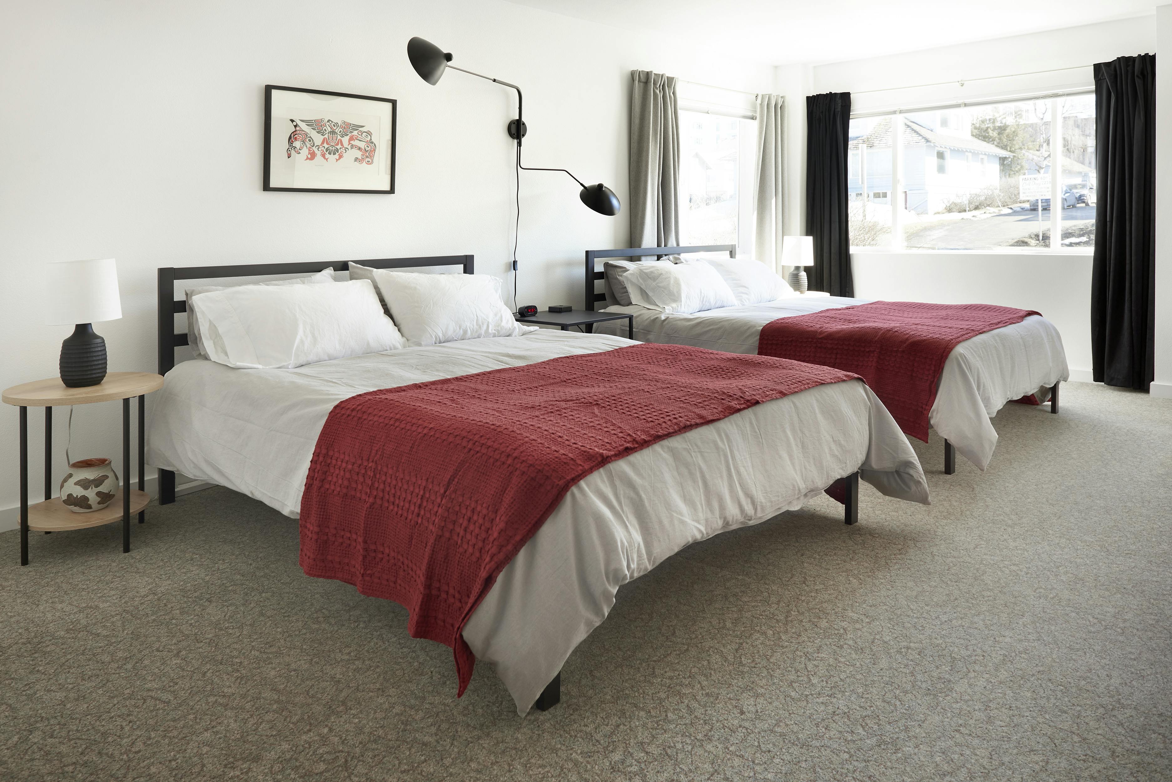 Two queen beds, attached bathroom, full kitchen.