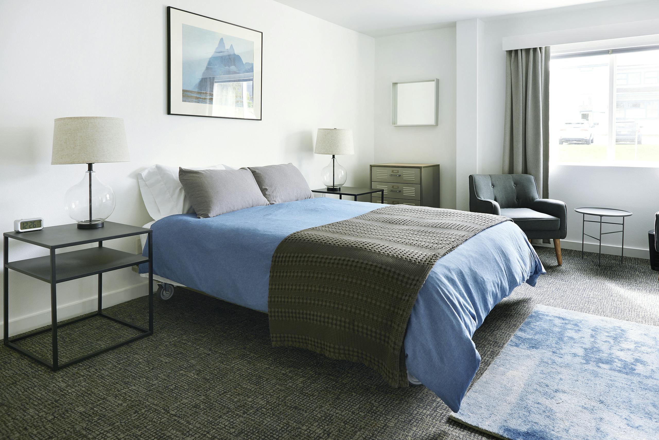 Queen bed with shared bathroom