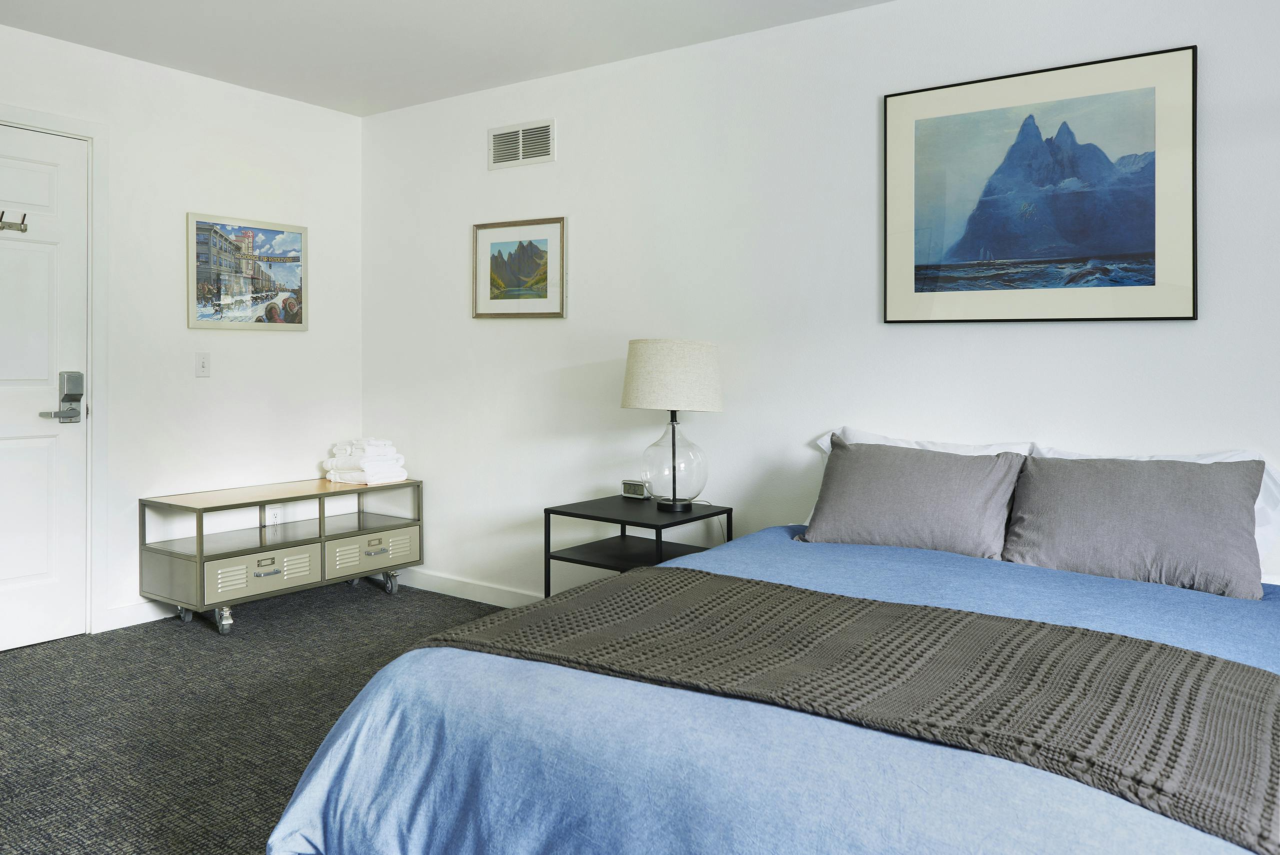 Queen bed with shared bathroom