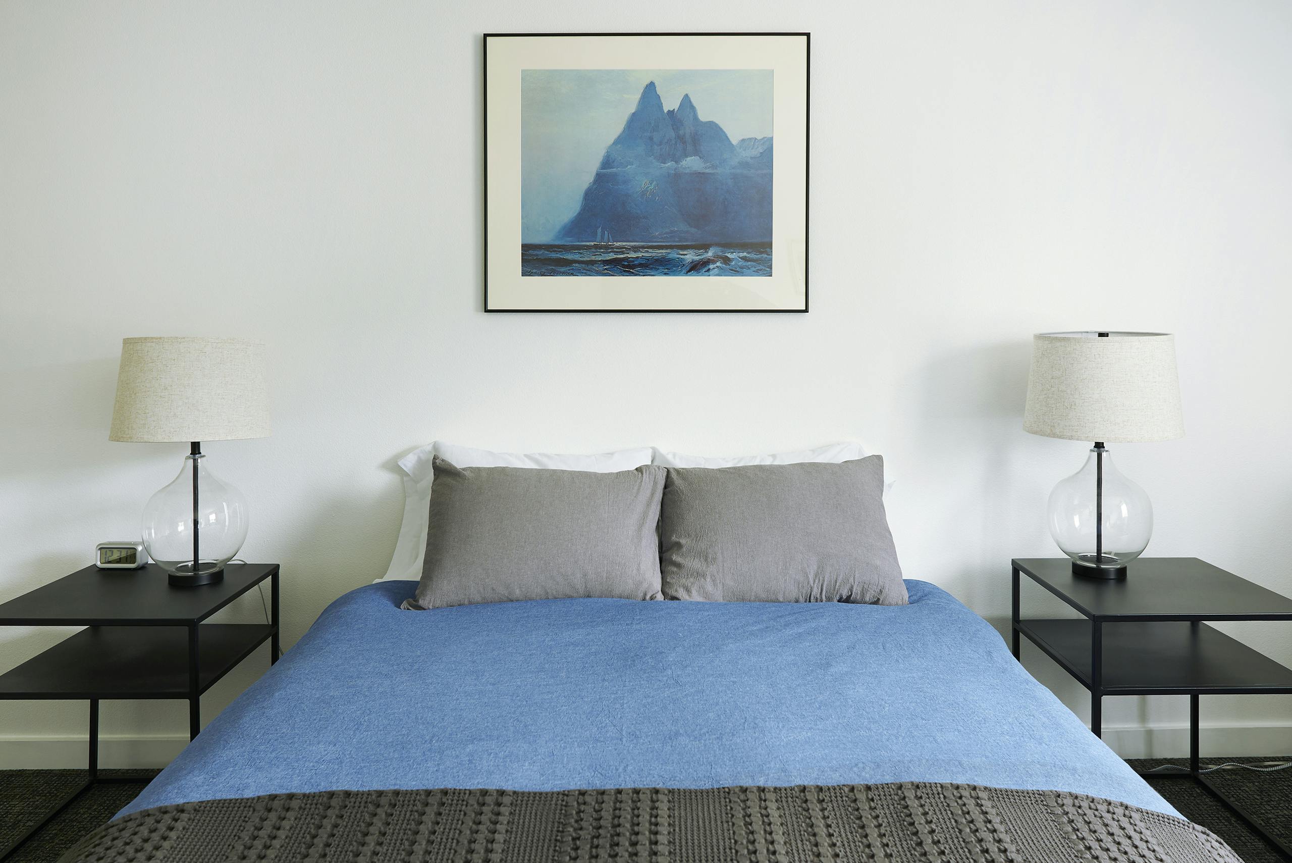 Queen bed with shared bathroom