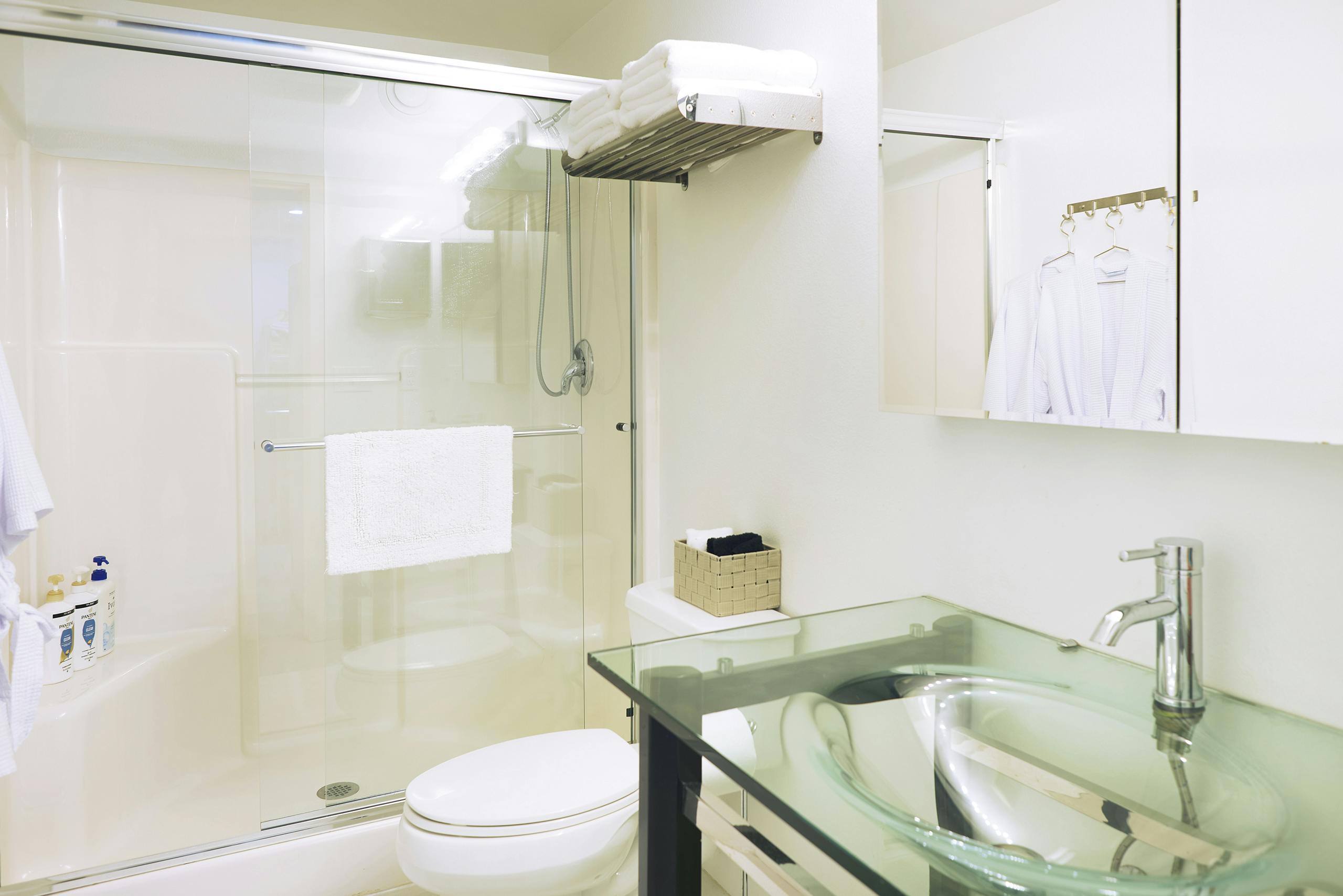 Queen bed with shared bathroom