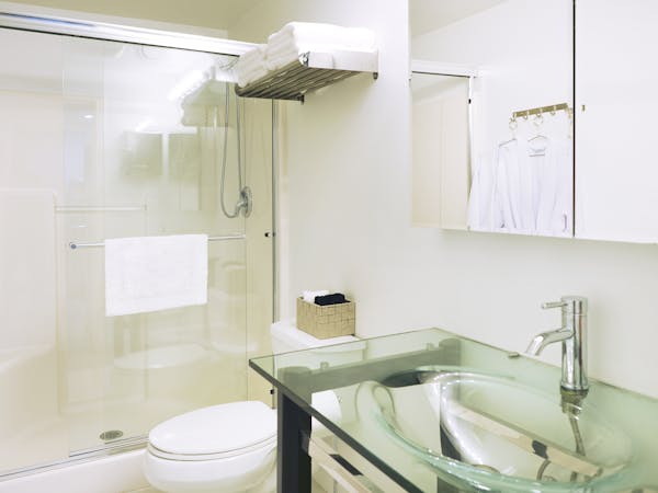 Queen bed with shared bathroom