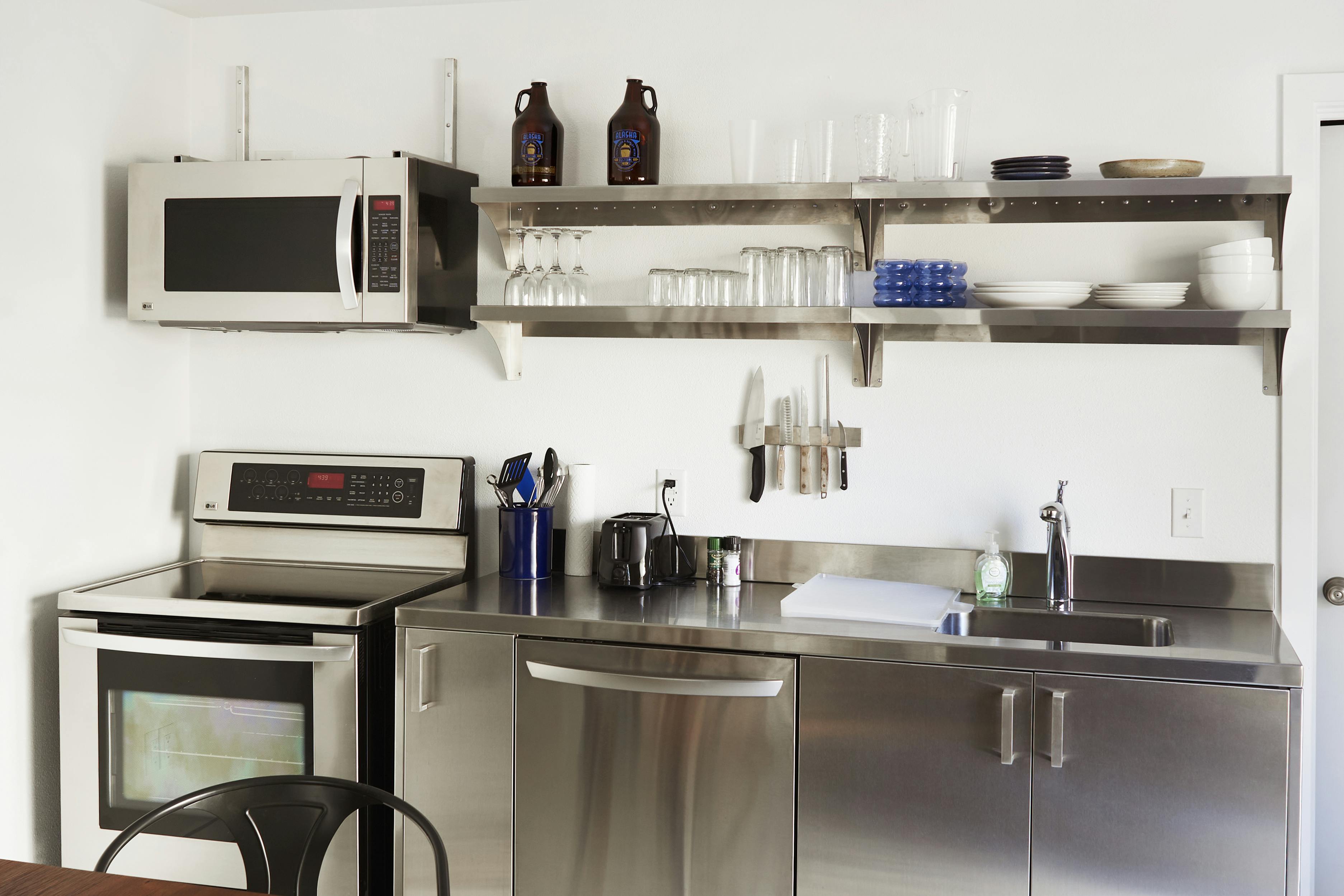 Two queen beds, attached bathroom, full kitchen.