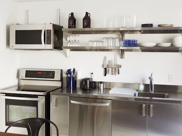 Two queen beds, attached bathroom, full kitchen.