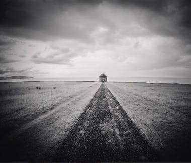 A gravel road going straight to the Mussenden Temple