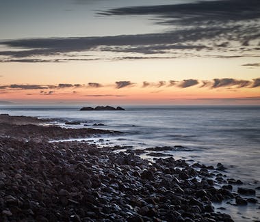 Wonderful colourful sunset on a rocky seafront