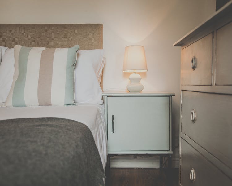 Homemade Shabby chic furniture in a double room with atmospheric lightning