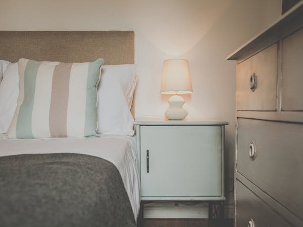 Homemade Shabby chic furniture in a double room with atmospheric lightning