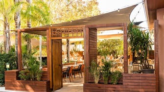 Relaxed alfresco dining with kid friendly playground