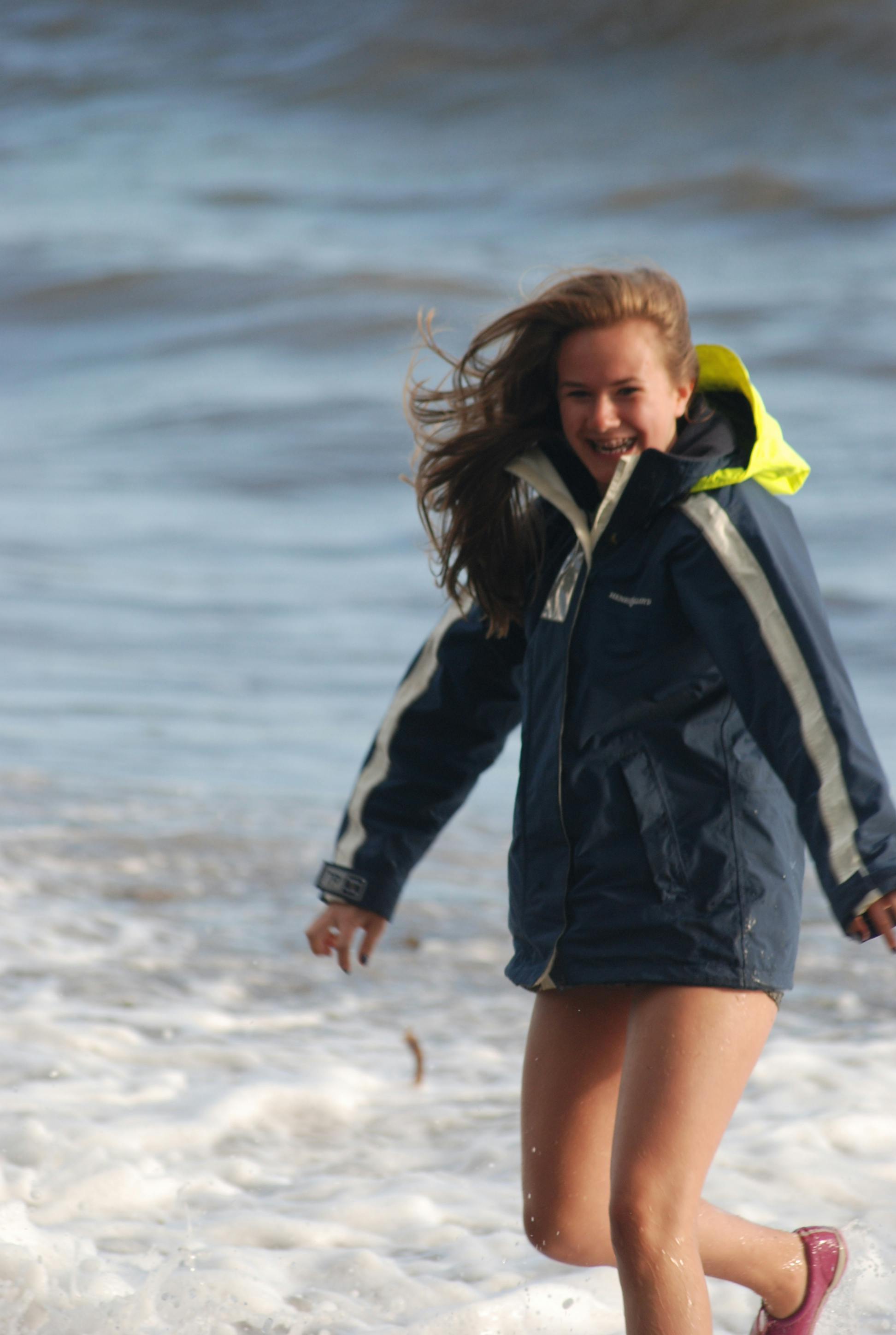 Grace splashing in the waves