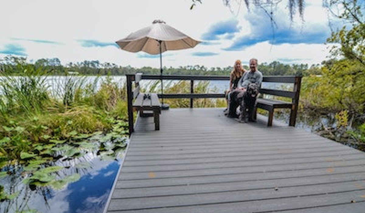 Mike, Judy & Bates on the dock at Lake Lagonda