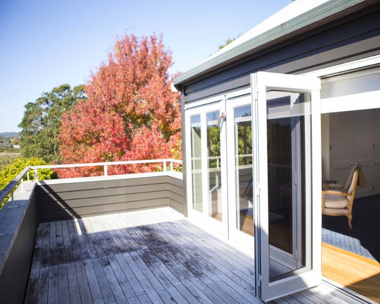 Sunny outdoor deck - Purangi Suite, 970 Lonely Bay Lodge