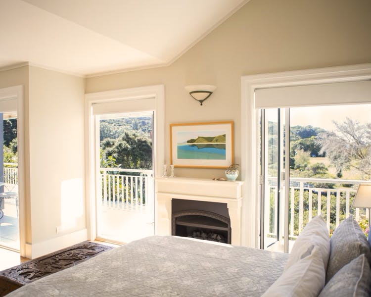Master bedroom with gas fireplace - Estuary Terrace Suite, 970 Lonely Bay Lodge