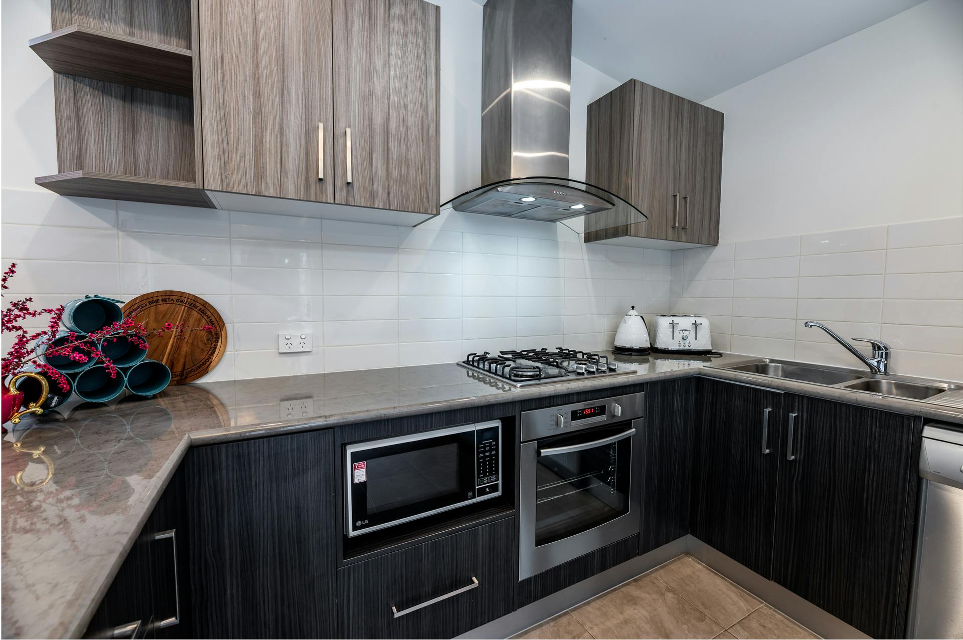 Kitchen with gas top, oven and microwave