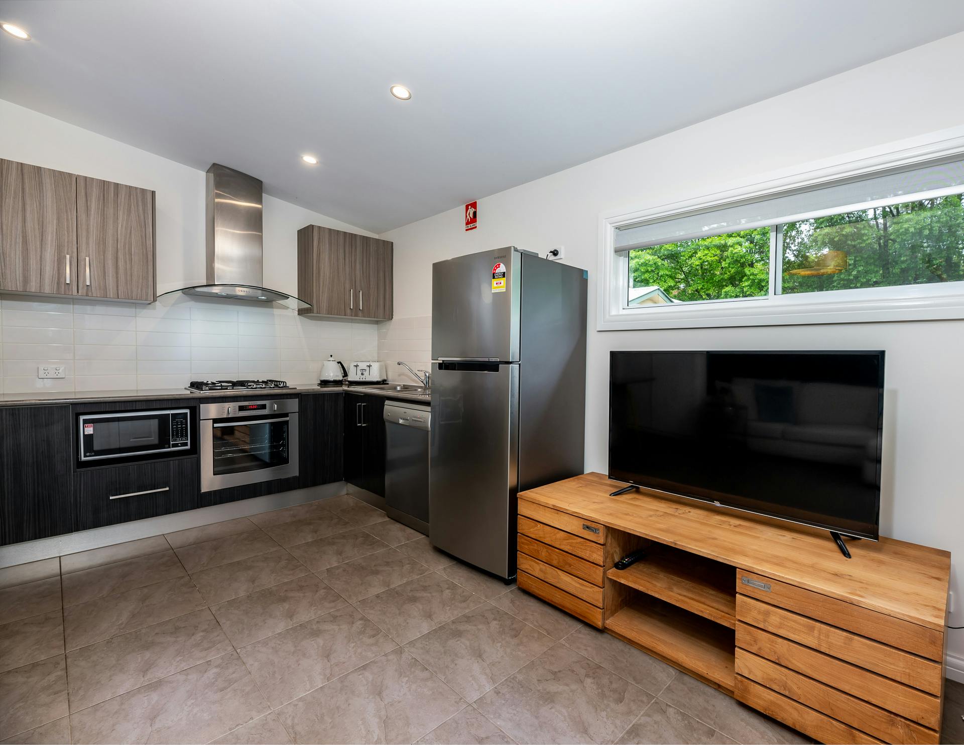 Full size fully equipped kitchen and tv