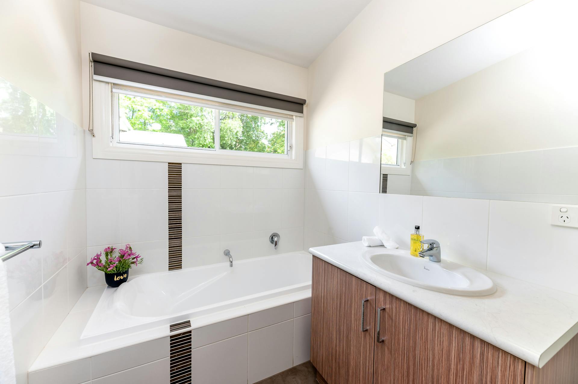 Bathroom with bath and sink