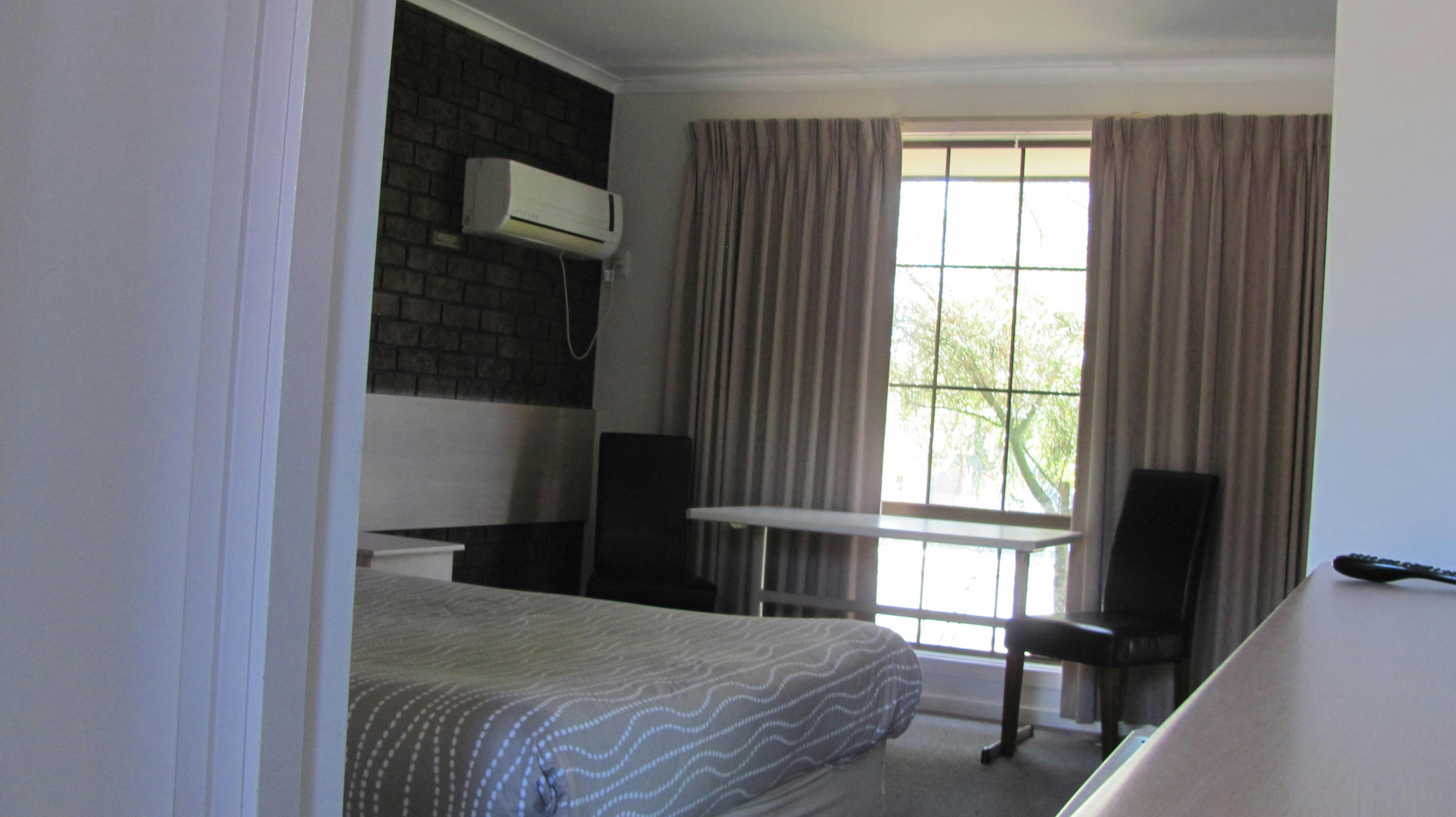 Family 2 room suite - main room with queen bed