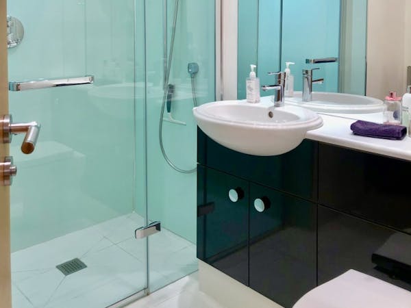 bedroom 2 En-suite wet room shower area with fitted cabinets