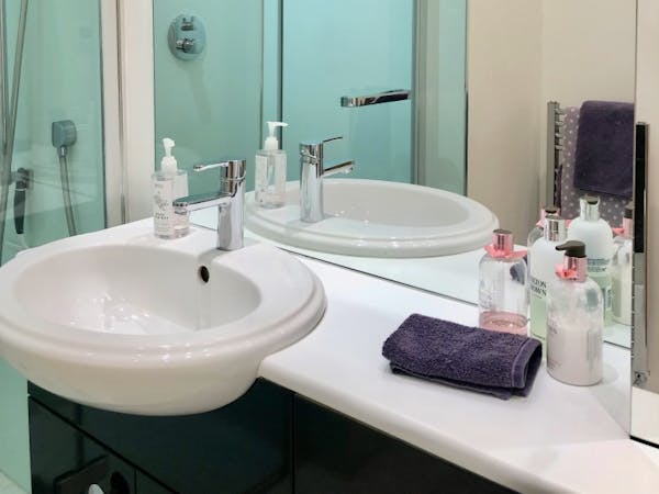 Bedroom 2 - En-suite integrated wash basin and oversized wall mirror