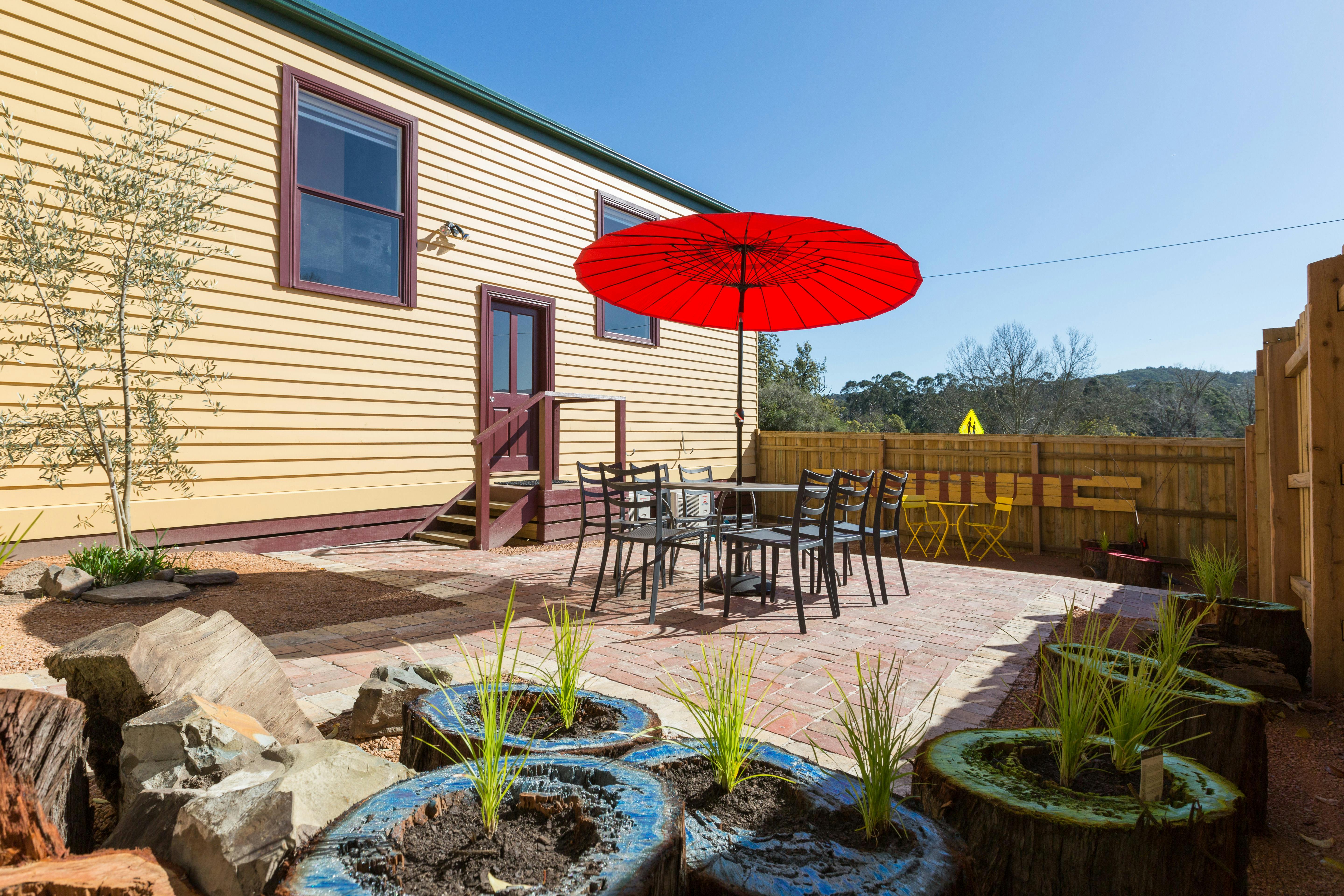 Plants and table and chairs in shared garden