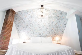 Lily's Hideaway guest room with blue wallpaper