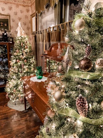 Christmas trees in gold, and bronze at The Victorian on Main, Fairfield, Il