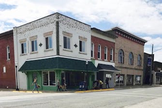 Brick building and storefronts lining Main Street in Fairfield, Il.