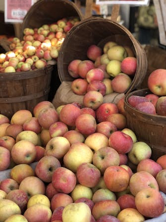Red and yellow apples in baskets