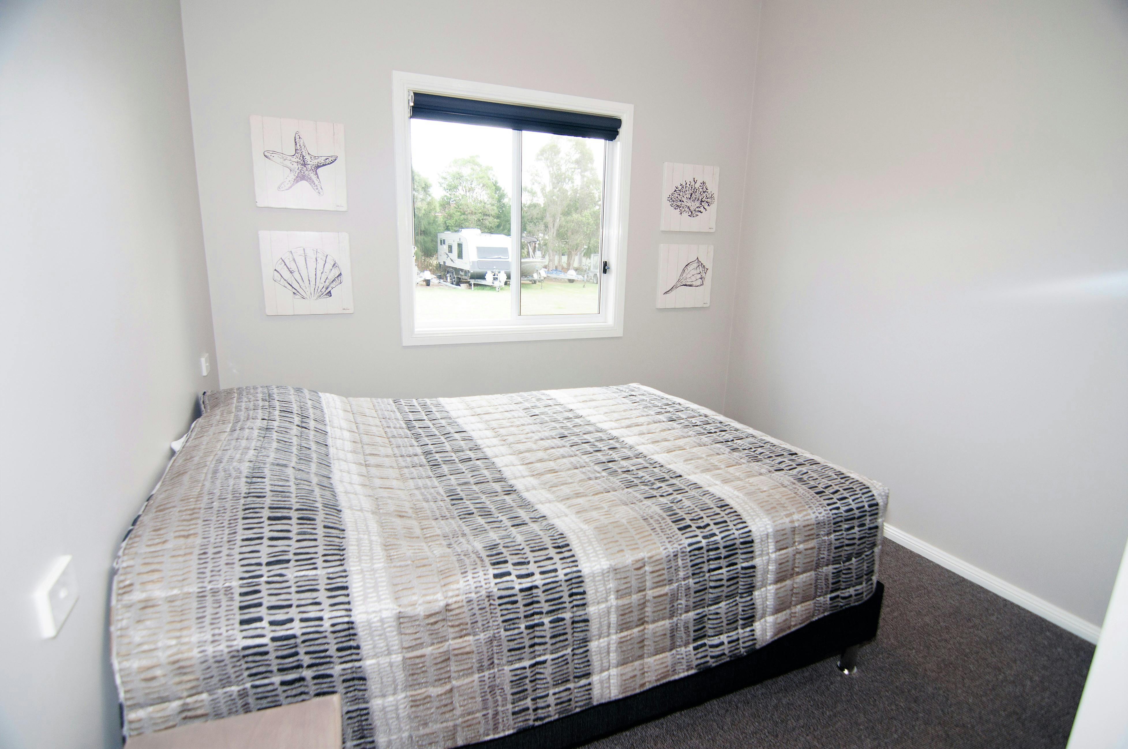 Unit 7 main bedroom with queen bed