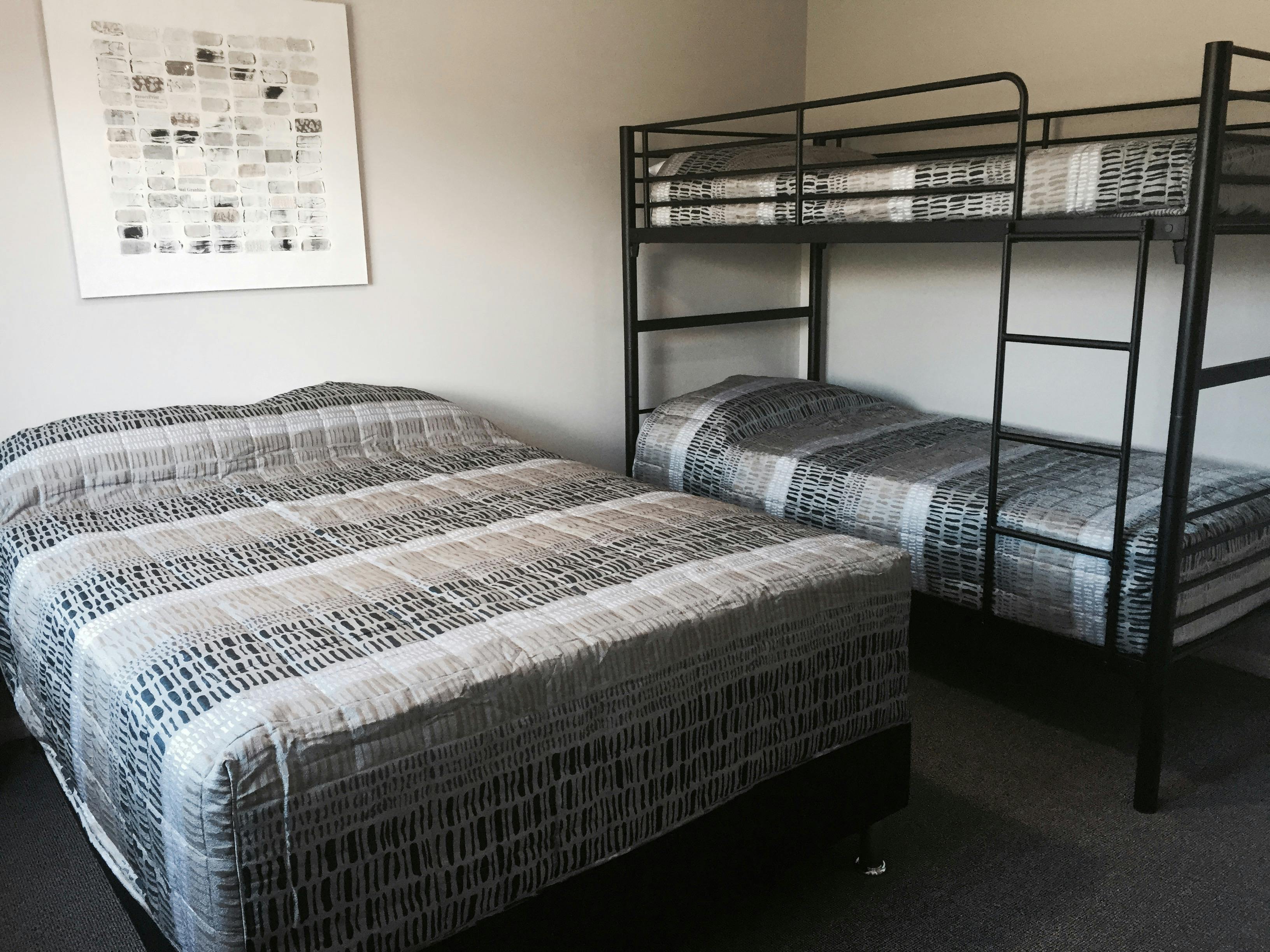 Unit 8 bedroom 2 with double bed and set of bunks