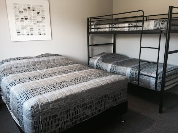 Unit 8 bedroom 2 with double bed and set of bunks