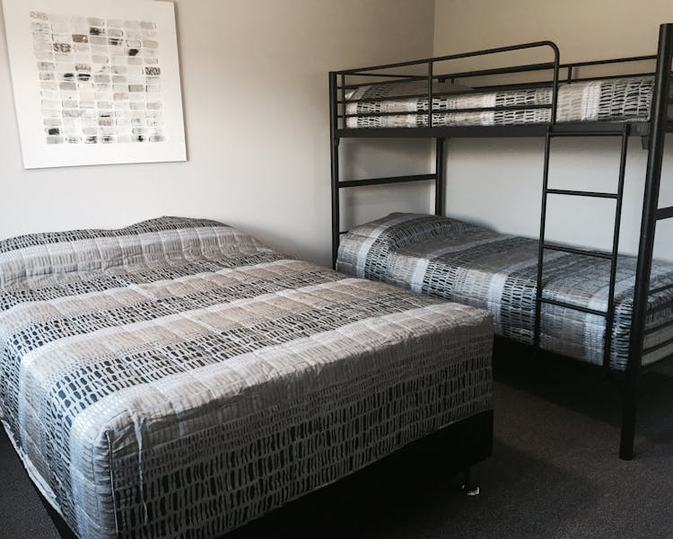 Unit 8 bedroom 2 with double bed and set of bunks