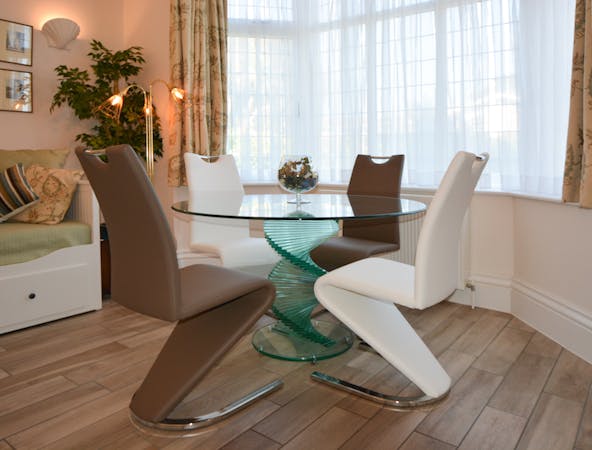 Haven Hall Hotel Garden Suite 1 glass dining table & mermaid chairs